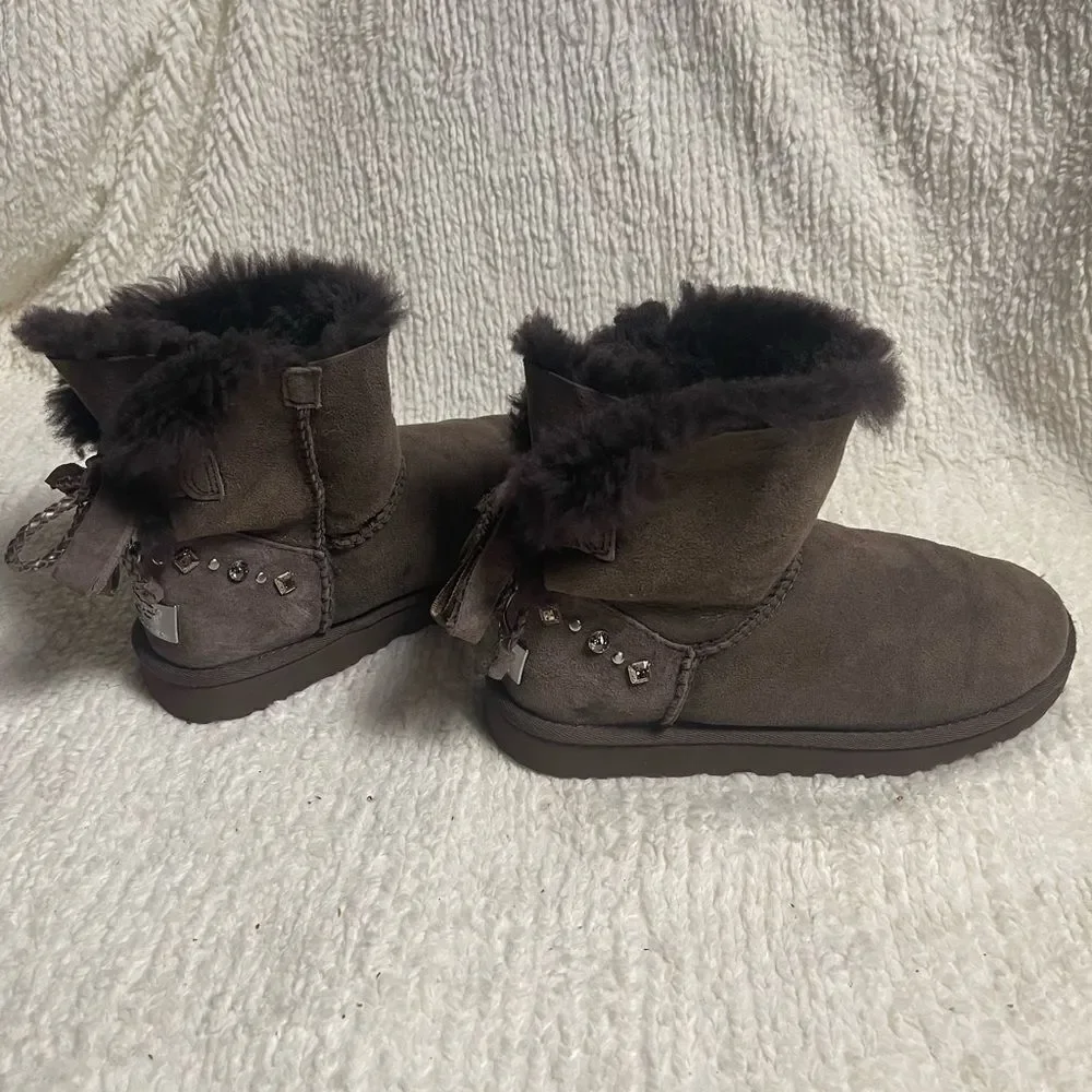 UGG Chocolate Shearling Boots with crystal and studs and bow accents SZ7
